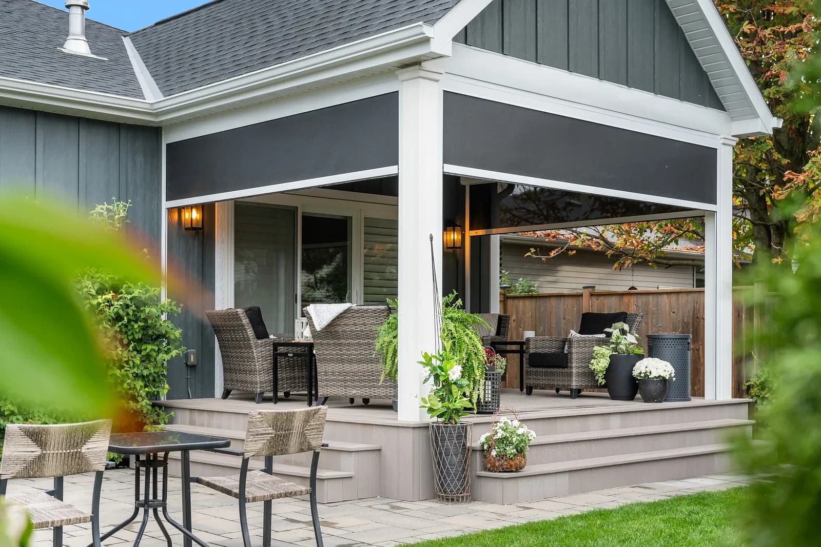 Cottage covered porch with deployed dark insect mesh